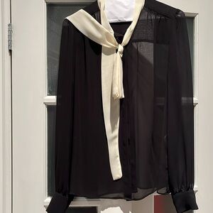 Beautiful Axara Paris sheer black blouse with cream bow.Size 8